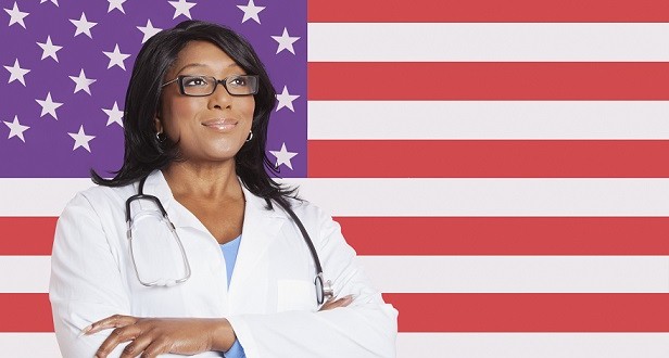 Female doctor in-front-of US flag
